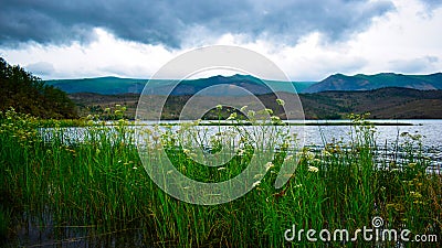 Dramatic rainy sky over Lake Baikal on a summer day. Stock Photo