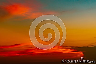 Dramatic red and orange sky and clouds abstract background. Red-orange clouds on sunset sky. Warm weather background. Art picture Stock Photo