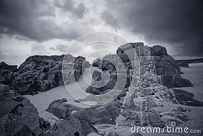 Dramatic seaside striped rocks Stock Photo