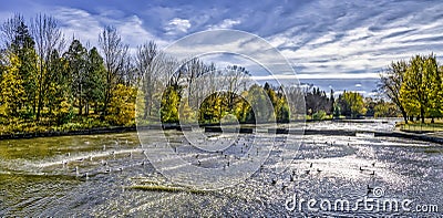 Dramatic sky on a northern river in Fall Stock Photo