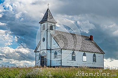 Dramatic sky over the historic Peace Lutheran Church in Stonehenge, SK Stock Photo