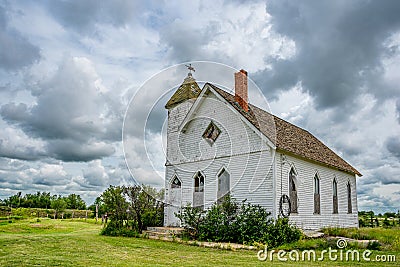 Dramatic sky over the historic Trossachs United Church in Trossachs, SK Stock Photo