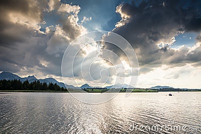 Dramatic sky over Lake Hopfensee Stock Photo