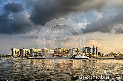 Dramatic sky over modern waterfront development Editorial Stock Photo