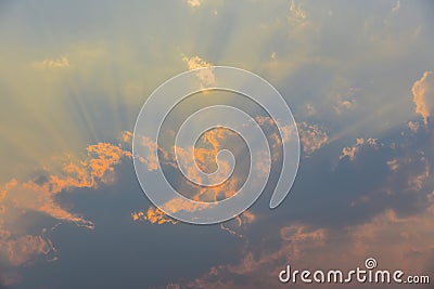 Dramatic sky and Sun Rays Background, stormy Clouds in dark sky, sunbeams light Stock Photo