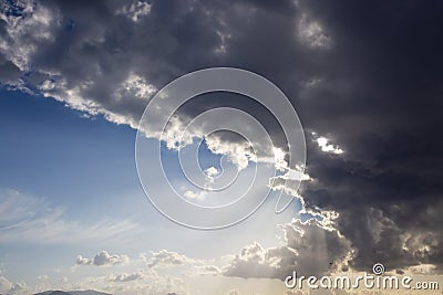 Dramatic Sky and Sun Rays Background. Sunbeams Light and Moody Cloudscape Stock Photo