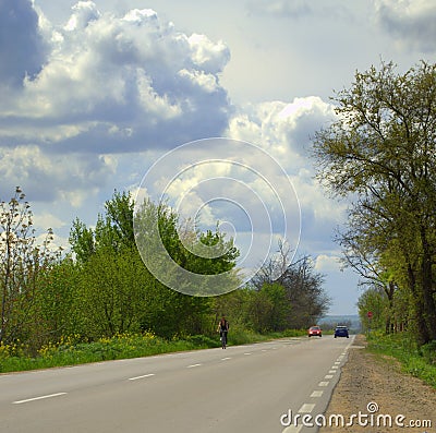 Dramatic spring sky and road Stock Photo