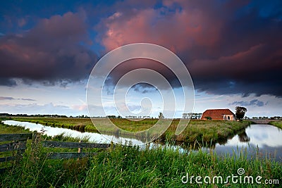 Dramatic sunrise over Dutch farmland Stock Photo