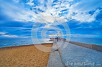 Dramatic sunset from levee of San Sebastian Castle, Cadiz, Spain Editorial Stock Photo