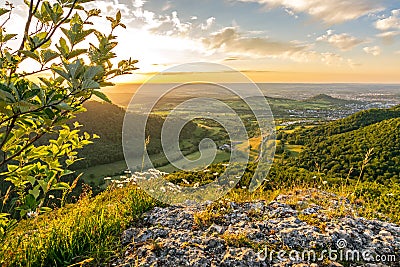 Dramatic sunset over rock ledge in the Swabian Alps in Southern Germany Stock Photo