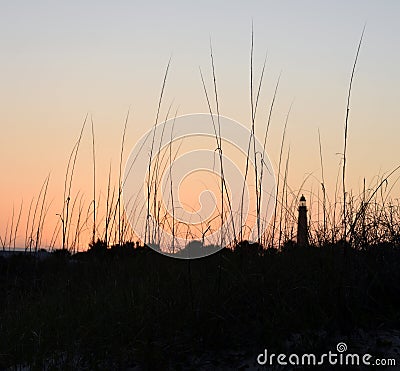 Southern Historical Lighthouse Coastal Architecture and Sunset/Sunrise at the Beach Stock Photo