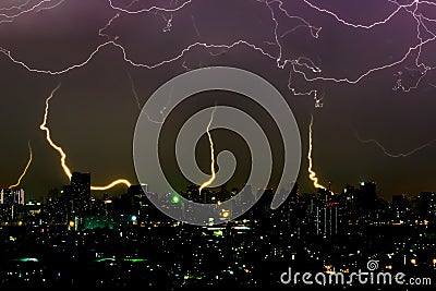 Dramatic thunder storm lightning bolt on the horizontal sky and city scape Stock Photo