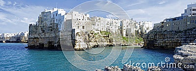 The seashore of Adriatic Sea with dramatic view of cliffs with caves rising from Adriatic sea in Polignano a Mare Editorial Stock Photo