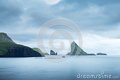 Dramatic view on Drangarnir and Tindholmur sea stacks Stock Photo