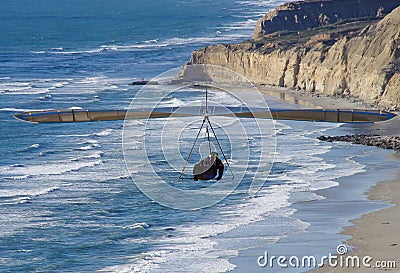 Dramatic view of hang glider approaching Torrey Pines Gliderport, La Jolla, CA. Stock Photo
