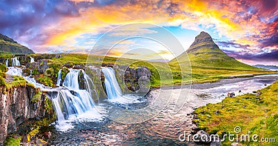 Dramatic view on Kirkjufellsfoss waterfall near Kirkjufell mountain at sunset Stock Photo