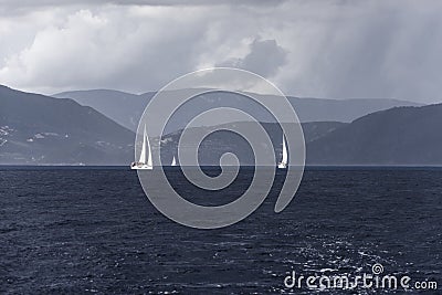 Dramatic view of sailing boats on the sea before the storm Stock Photo
