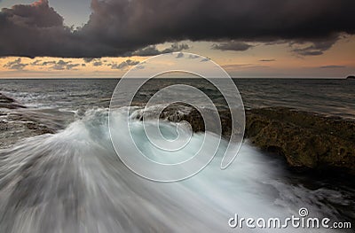 Dramatic waves at sunset in Kudat, Sabah, Borneo, East Malaysia Stock Photo