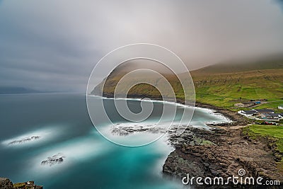 Dramatic long exposure of Faroe islands at Gjov gorje Stock Photo