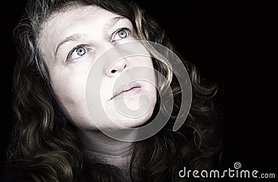 Dramatic woman looks at sky Stock Photo