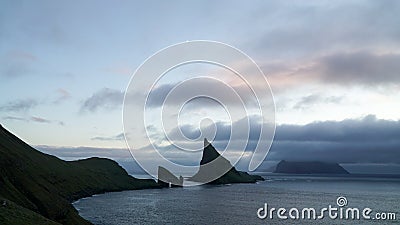 Drangarnir Sea Stack Rock in the Atlantic ocean on VÃ¡gar Island, Faroe Islands. Stock Photo