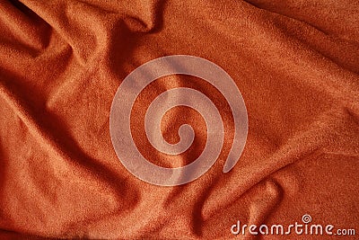 Draped reddish orange artificial suede fabric Stock Photo