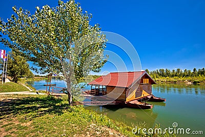 Drava river floating wooden cabin Stock Photo