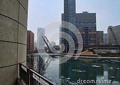 Drawbridge up over frozen Chicago river on a winter morning in Chicago Editorial Stock Photo