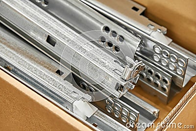 Drawer system slide folded into a cardboard box closeup Stock Photo