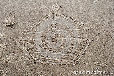 A drawing a boat in the sand on beach Stock Photo