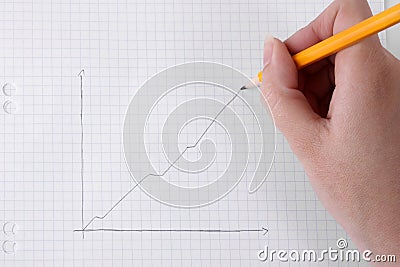 Drawing business graph on graph paper Stock Photo