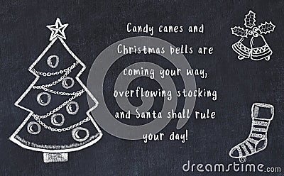 Drawing of christmas tree and handwritten greetings on black chalkboard Stock Photo