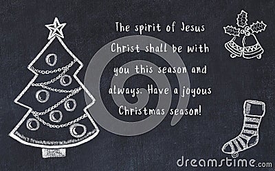 Drawing of christmas tree and handwritten greetings on black chalkboard Stock Photo