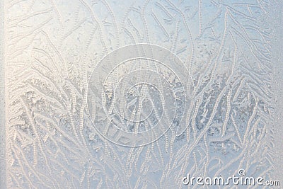 Drawing on glass in a frost . Frosty picture on the window. Frost pattern Stock Photo
