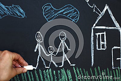 Drawing happy homosexual parents with child on a chalk board. Gay family concept Stock Photo