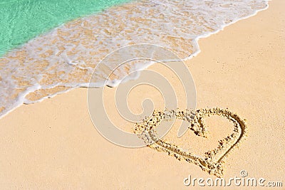 Drawing heart on beach Stock Photo