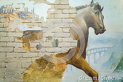 Drawing of a horse on a background of mountains on a brick wall. Editorial Stock Photo