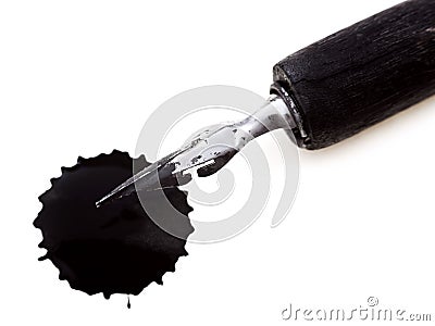 Drawing pen with metal nib and black ink blot Stock Photo