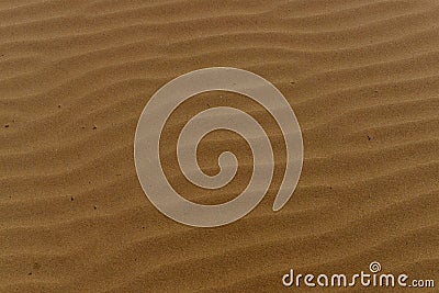 Drawing on the sand after the waves. Latvia. Stock Photo