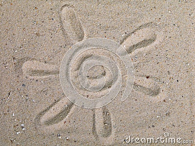 Drawing sun on sand Stock Photo