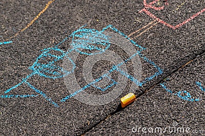 Drawing of a train in the sun on a textured black floor Stock Photo