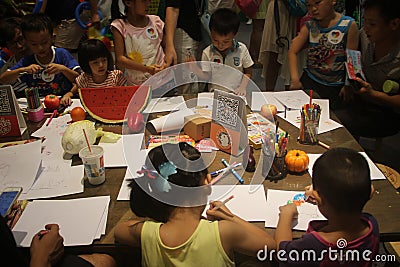 Drawings of children in the SHENZHEN Tai Koo Shing Commercial Center Editorial Stock Photo