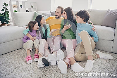 Dream dreamy positive people family sit floor carpet little preteen schoolgirl tell say school novelties cuddle sister Stock Photo