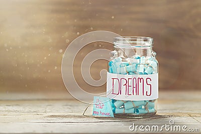 Dream house Full glass jar cherished wishes Stock Photo