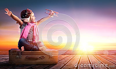 Dream journey - Little Girl On Vintage Suitcase Stock Photo