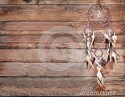 Dreamcatcher, american native amulet on wooden background. Shaman Stock Photo