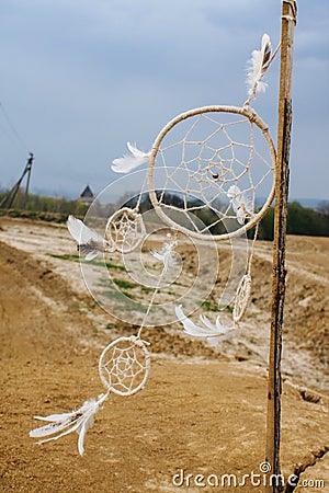 Dreamcatcher hanging in a dry land. Stock Photo