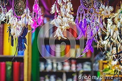 Dreamcatchers, candles and other trinkets at a christmas market in Germany. Colorful holidays background concept Stock Photo
