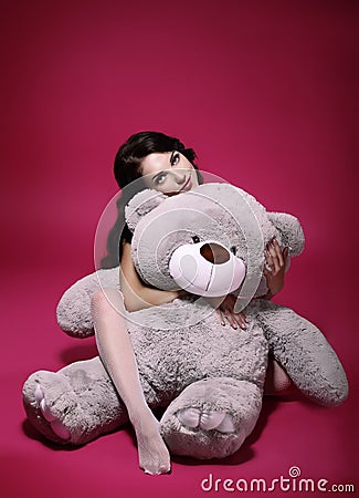 Dreaminess. Sentimental Girl with Soft Toy - Gray Bruin in Embrace Stock Photo