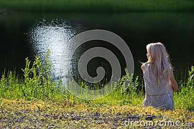 Dreaming girl on shore Stock Photo